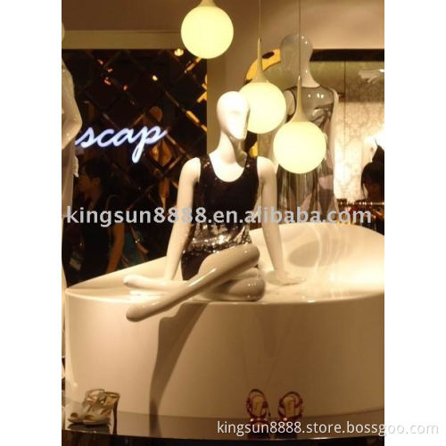 sitting headless female mannequin